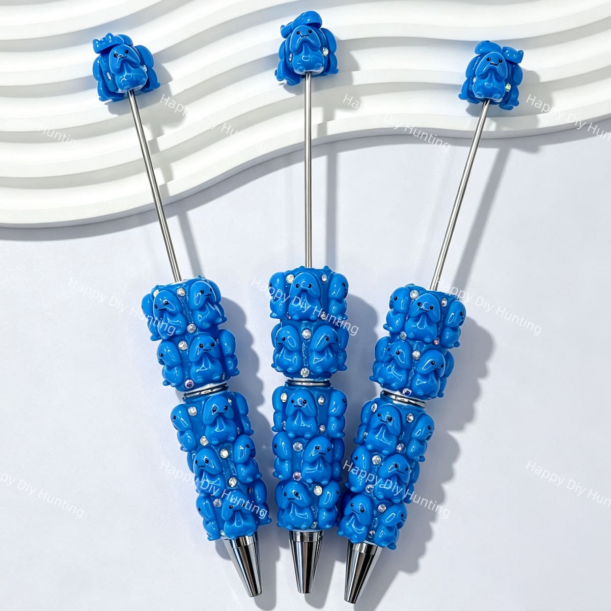 close-up 3D blue Richard beadable pen showing dimensional character design and beadable barrel