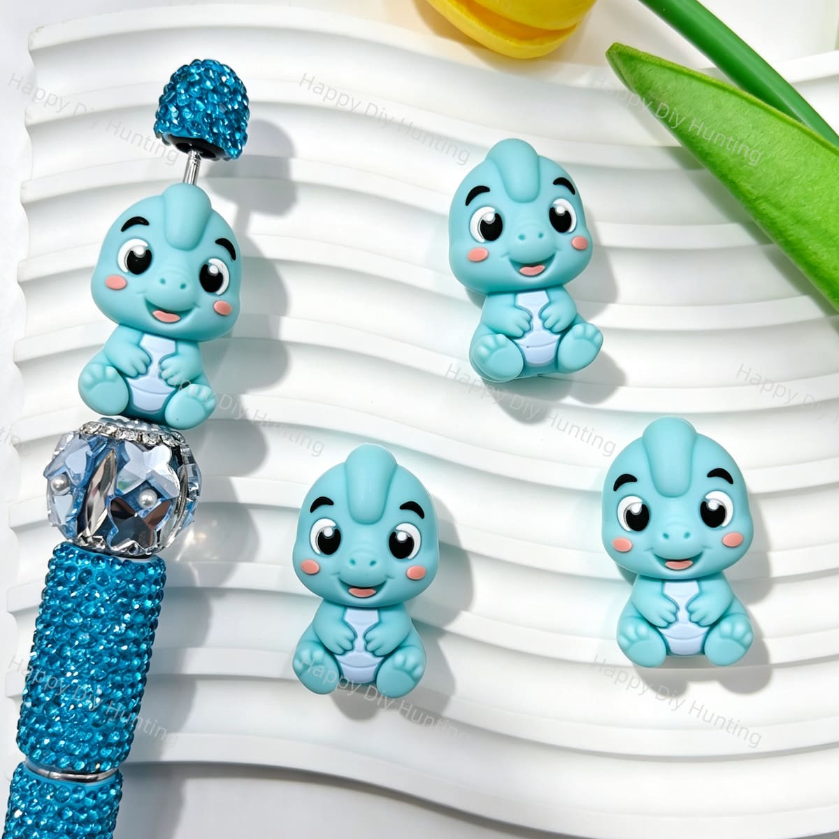 Silicone focal beads featuring a cute light blue 3D dinosaur design. Soft, durable, and flexible, perfect for beadable pens, keychains, and handmade crafts.