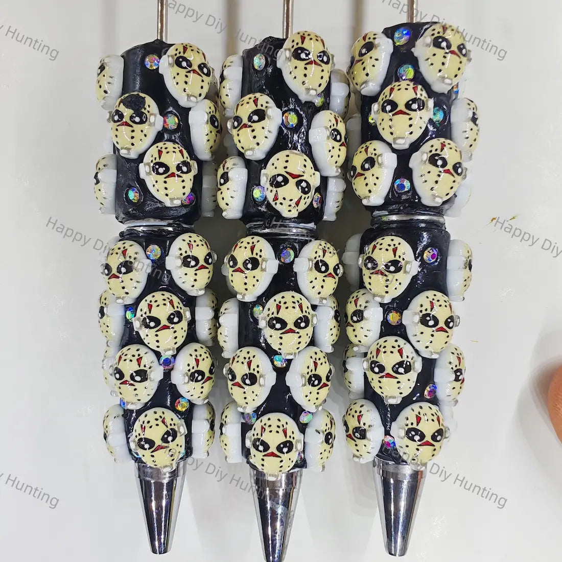 pre‑assembled hockey‑style horror mask 3D figurine beadable pens, black base with embedded sparkling rhinestones, spooky halloween themed craft ballpoint pens bulk