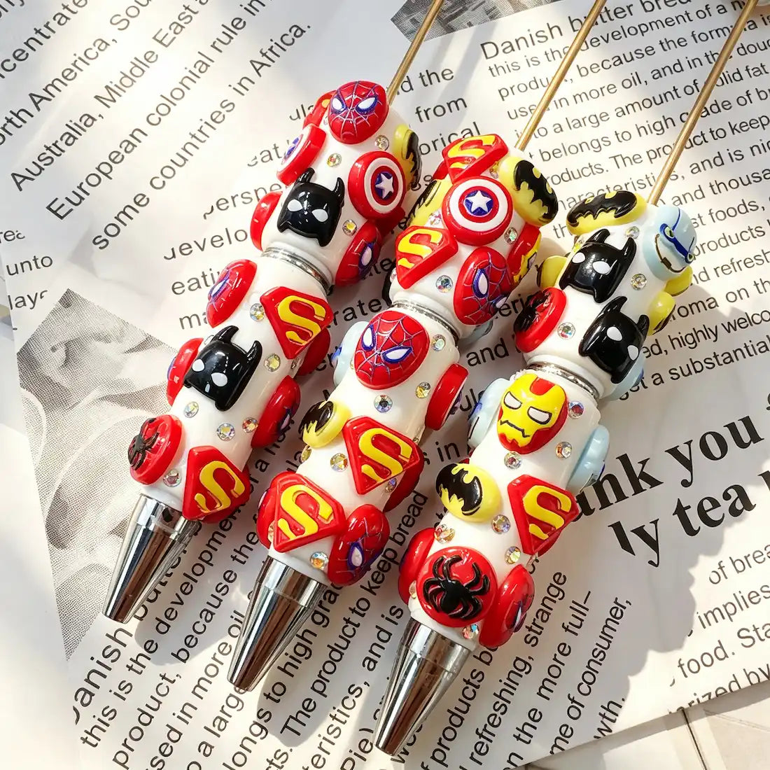 white base mixed pop‑culture hero symbol graphic decorated beadable pens for diy handmade craft stationery wholesale
