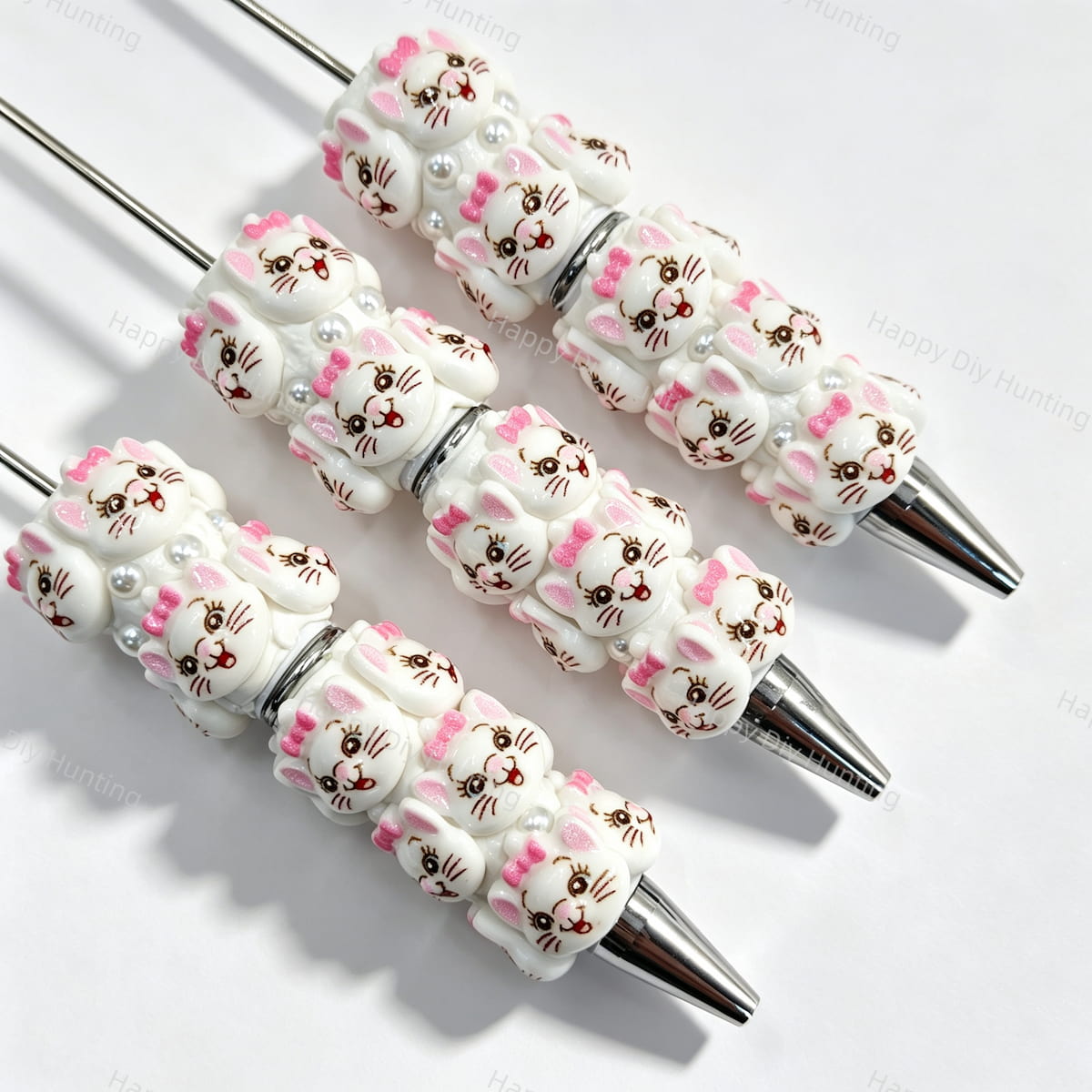 White cartoon bow cat character beadable pens. Refillable and customizable, matching all focal beads and pen toppers. Perfect for DIY crafts, handmade gifts, and craft fair retail.