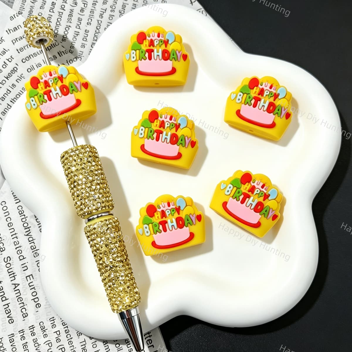 Yellow silicone focal beads featuring a Happy Birthday cake graphic design. Soft, durable, and flexible, perfect for beadable pens, keychains, and handmade crafts.