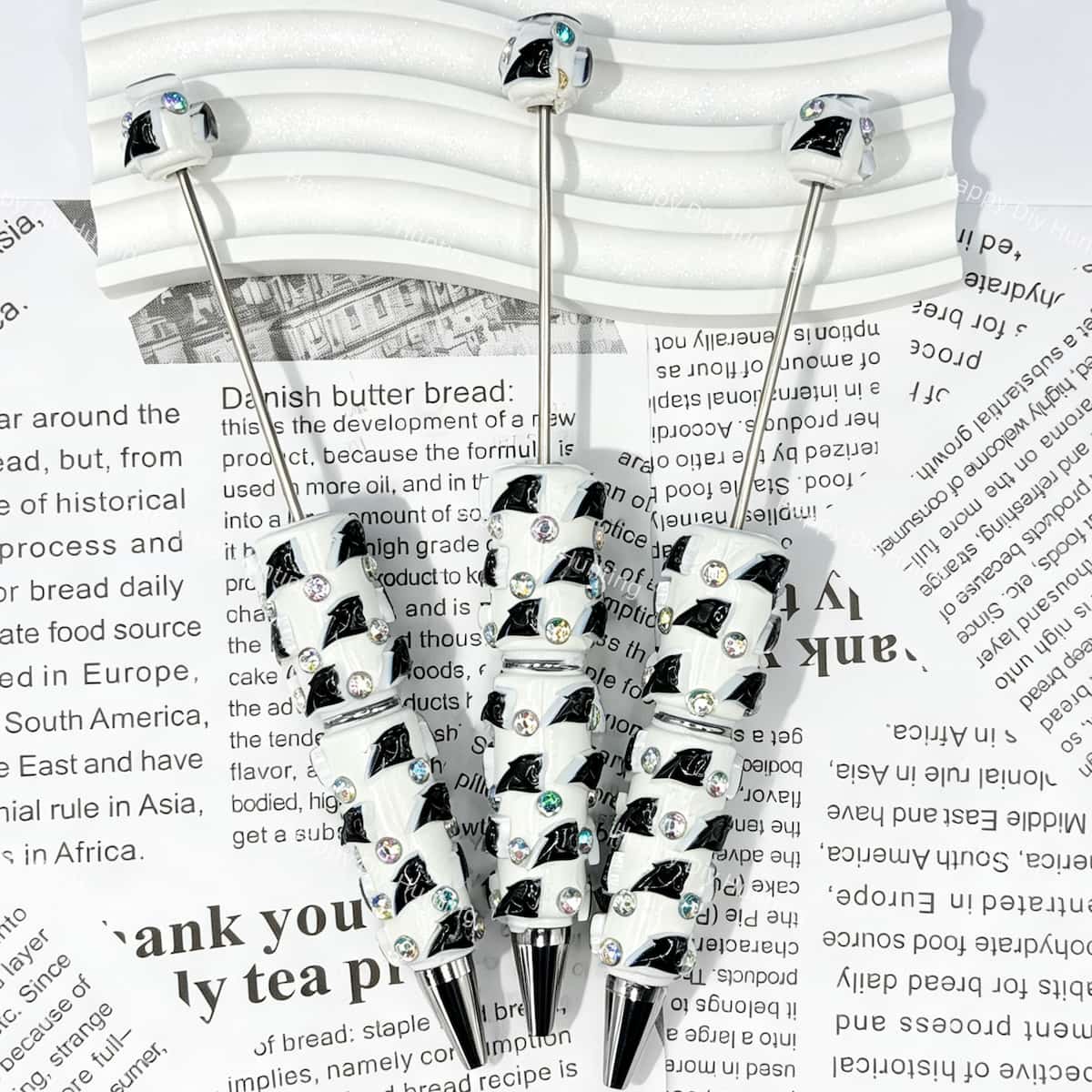 close-up black panther CP football beadable pen showing panther design and beadable barrel