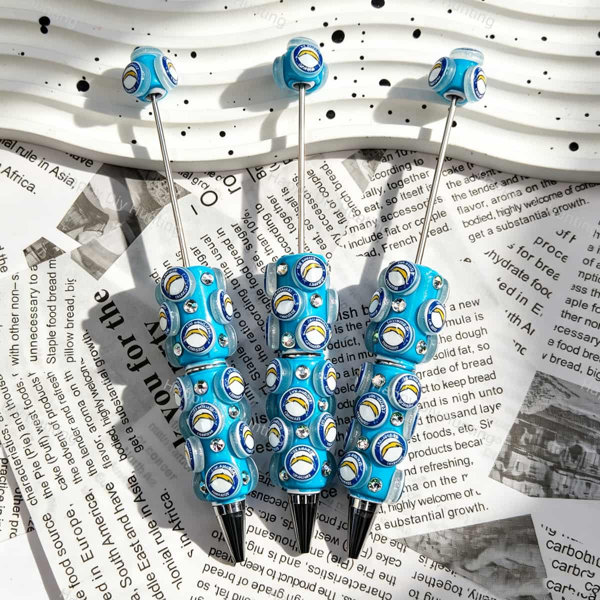 Bright blue football emblem sports beadable pens, circular printed beads with rhinestones for diy handmade stationery