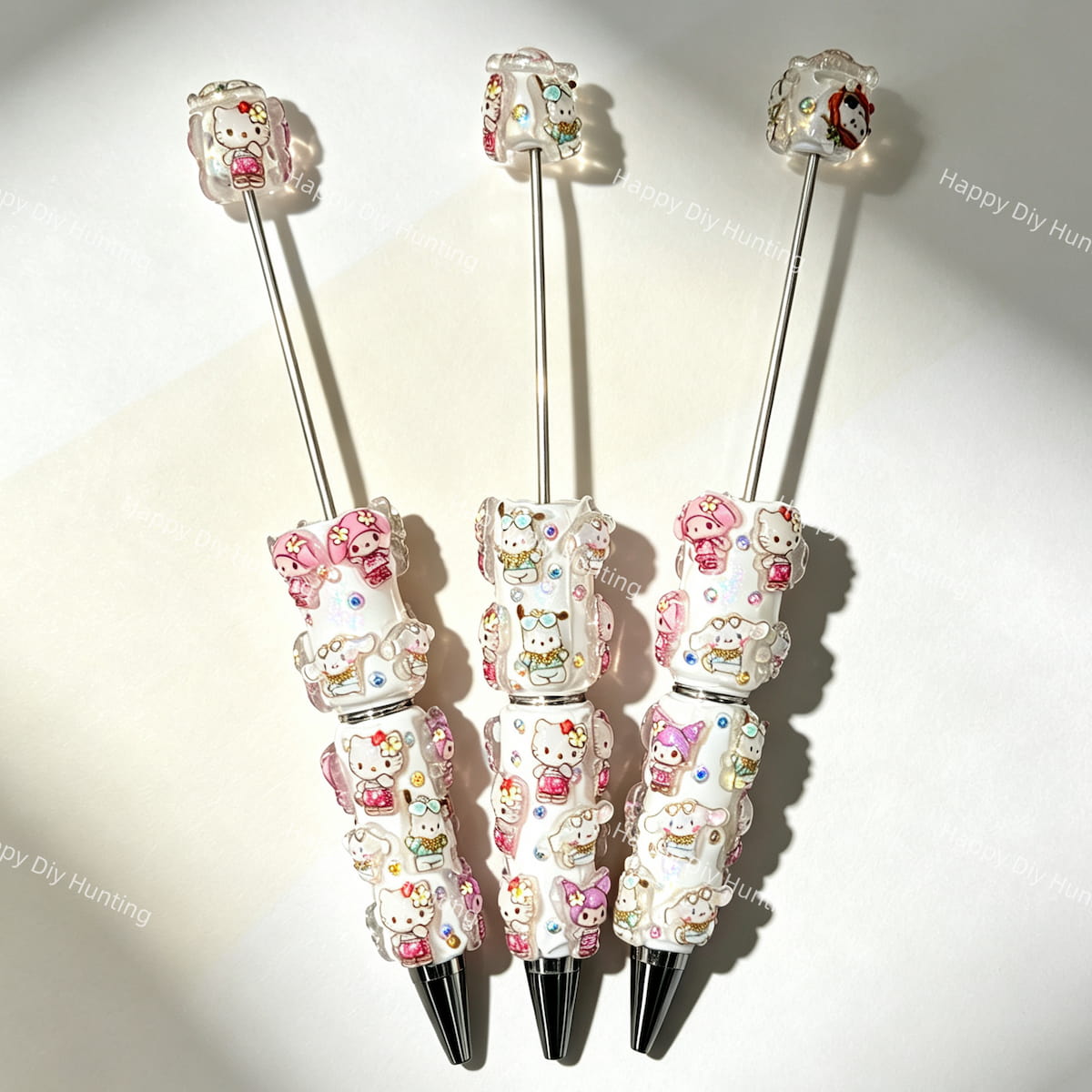 close-up cute character friends beadable pen showing 3D character figurine top and beadable barrel