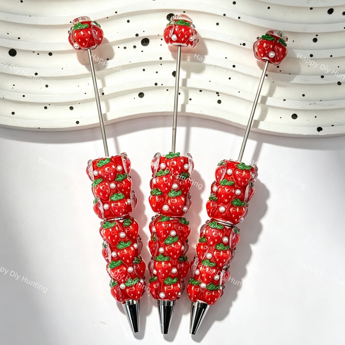 close-up cute strawberry beadable pen showing strawberry design and beadable barrel