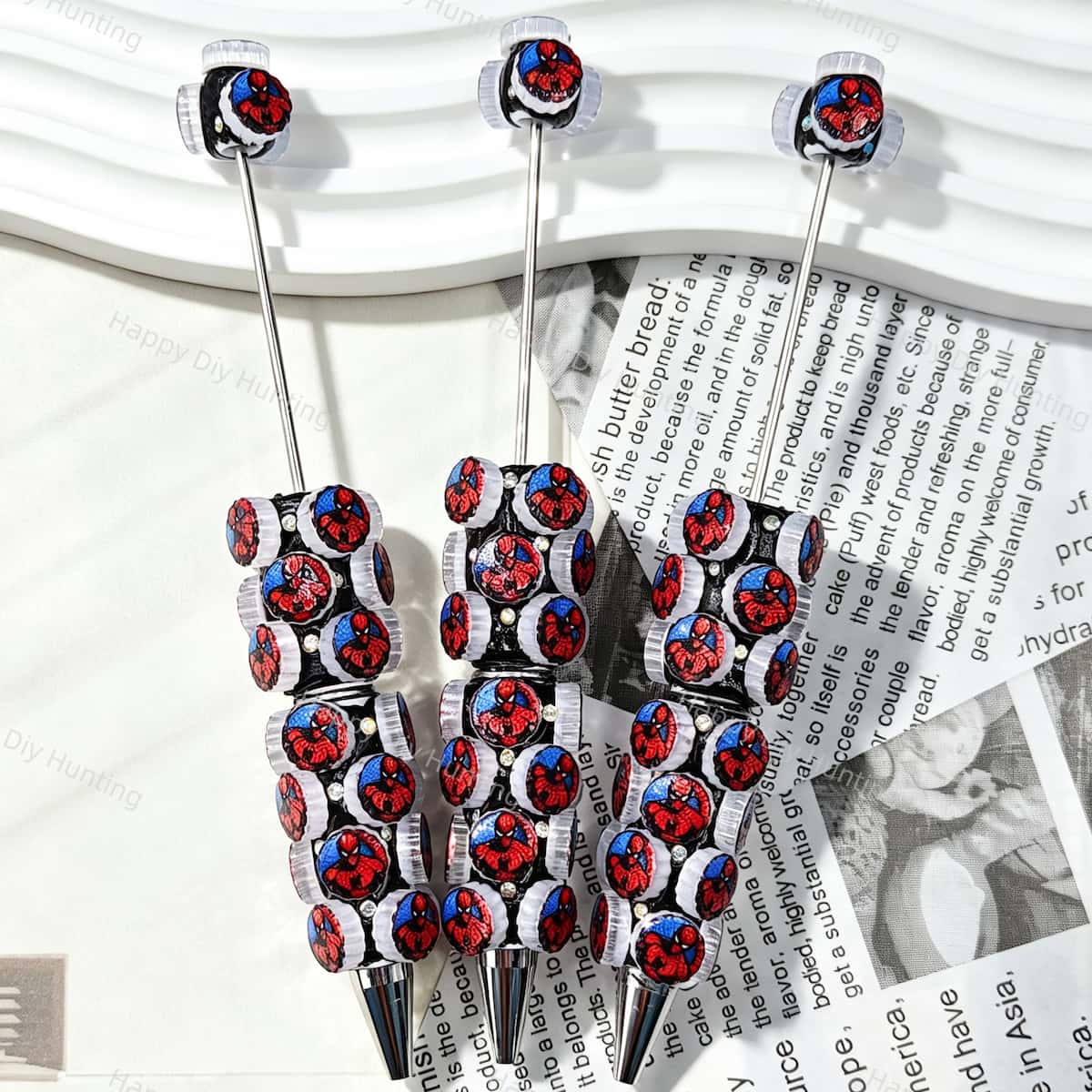 Red Blue Cartoon Hero Print Cartoon Character Beadable Pens closeup of printed silicone bead details on bead pen