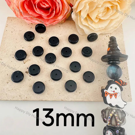 13mm solid black flat disc resin spacer beads with small central through hole, solid glossy black resin material for layering DIY beadable pens, Halloween bag charms and gothic handmade jewelry craft accessories.