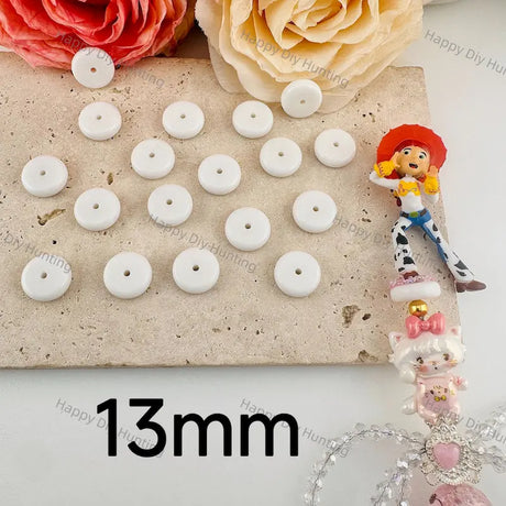 13mm solid white flat disc resin spacer beads with small central through hole, solid matte white resin material for layering DIY beadable pens, bag charms and handmade jewelry craft accessories.