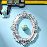 18mm mint green crown-shaped bead decorated with pearls and sparkling rhinestones. Elegant and shiny, perfect for beadable pens, keychains, and handmade crafts.