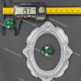 A green and white marbled glass bead is shown inside an ornate silver oval frame, with a caliper measuring the bead on the left and a yellow ruler at the top for scale, all on a dark gray background with Happy Diy Hunting watermarks.