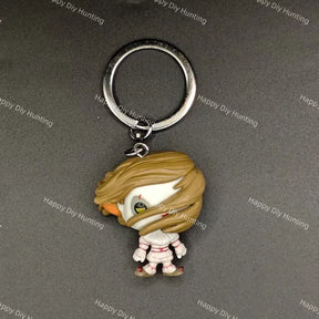 A chibi-style vinyl keychain featuring a character with light brown hair, a white face covering, and a pink-and-white outfit, attached to a silver metal split ring on a dark gray background with repeated 'Happy Diy Hunting' watermark text.