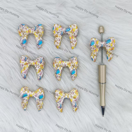 3D Winnie-themed Bowknot Silicone Focal Beads Wholesale, silicone focal beads for pens