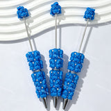 close-up 3D blue Richard beadable pen showing dimensional character design and beadable barrel