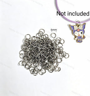 6mm silver open jump rings made of sturdy metal with a smooth finish. Perfect for connecting charms, beads, and pendants in DIY jewelry making and handmade crafts.