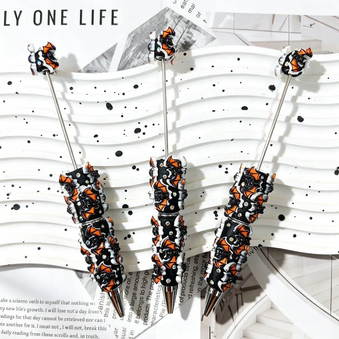 black base orange‑white spooky bat graphic decorated beadable pens for halloween diy handmade craft stationery wholesale