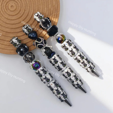 Black witch sprite character beadable pen, creepy cute goth DIY craft stationery supplies