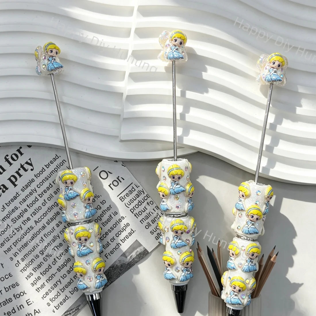 pre‑assembled blue‑gown blonde princess 3D figurine beadable pens, glitter off‑white base with sparkling rhinestones, cute girl themed craft ballpoint pens bulk