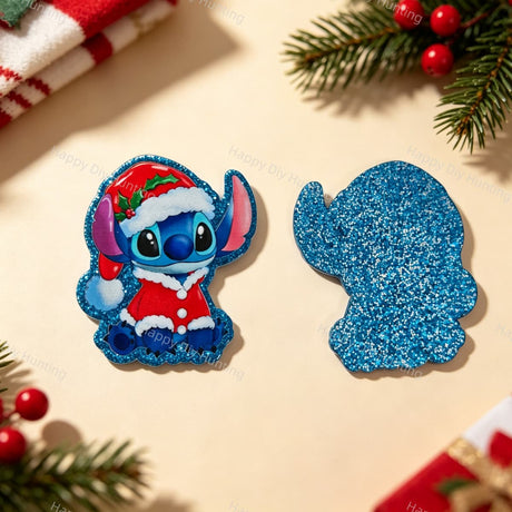 A blue alien character wearing a Santa hat and red suit, shown from the front and back. The front features a detailed printed design, while the back is covered in blue glitter. Perfect for DIY beadable pens, keychains, and handmade holiday crafts.