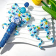 Bow-shaped silicone focal beads featuring a blue alien and pineapple print design. Soft, durable, and flexible, perfect for beadable pens, keychains, and handmade crafts.