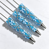 Blue beadable pen featuring a decorative bow and sparkling rhinestones. Refillable and customizable, perfect for DIY crafts and handmade gifts.