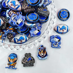 Acrylic focal beads featuring a blue lion football themed print design. Lightweight, sporty, and durable, perfect for beadable pens, keychains, and handmade crafts.