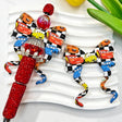 Bow-shaped silicone focal beads featuring a cartoon car and checkered print design. Soft, durable, and flexible, perfect for beadable pens, keychains, and handmade crafts.