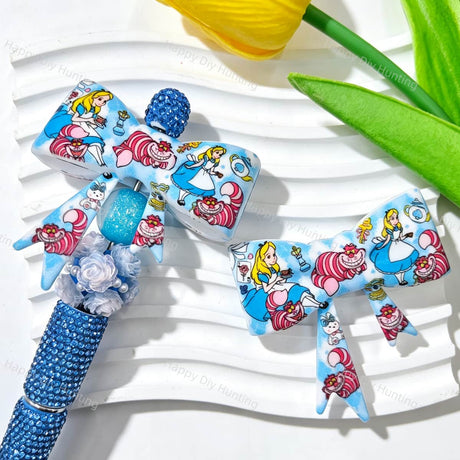 Silicone bow beads featuring a cartoon girl and cat print design. Soft, durable, and flexible, perfect for beadable pens, keychains, and handmade crafts.