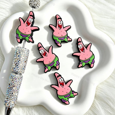 Silicone focal beads featuring a cheerful pink starfish cartoon design. Soft, durable, and flexible, perfect for beadable pens, keychains, and handmade crafts.