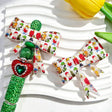 Bow-shaped silicone focal beads featuring a Christmas cartoon character print design. Soft, durable, and flexible, perfect for beadable pens, keychains, and handmade holiday crafts.