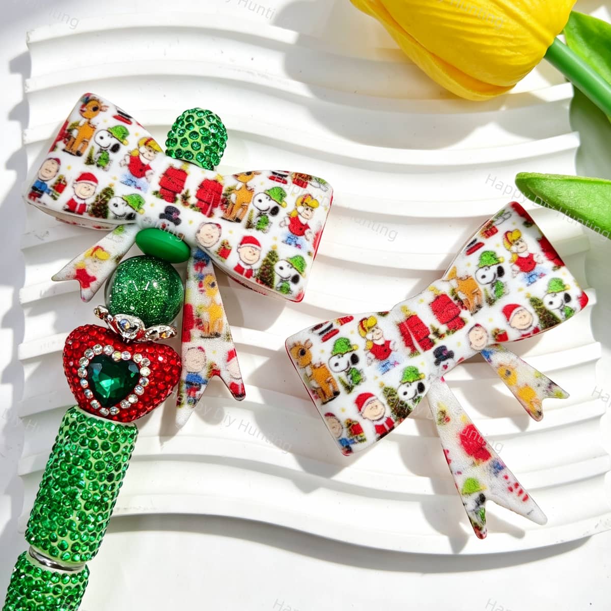 Bow-shaped silicone focal beads featuring a Christmas cartoon character print design. Soft, durable, and flexible, perfect for beadable pens, keychains, and handmade holiday crafts.