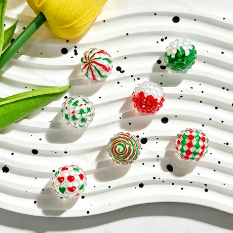 Round acrylic rhinestone beads featuring a Christmas red and green pattern. Lightweight, durable, and festive, perfect for beadable pens, keychains, and handmade holiday crafts.