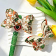 Bow-shaped beads featuring a Christmas snowman print design. Lightweight, festive, and durable, perfect for beadable pens, keychains, and handmade holiday crafts.