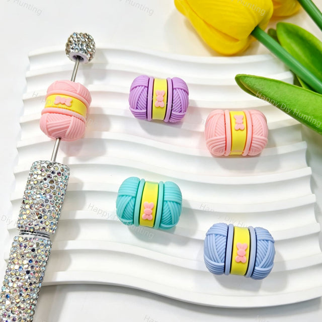 Silicone focal beads featuring a colorful 3D yarn ball design. Soft, durable, and flexible, perfect for beadable pens, keychains, and handmade crafts.