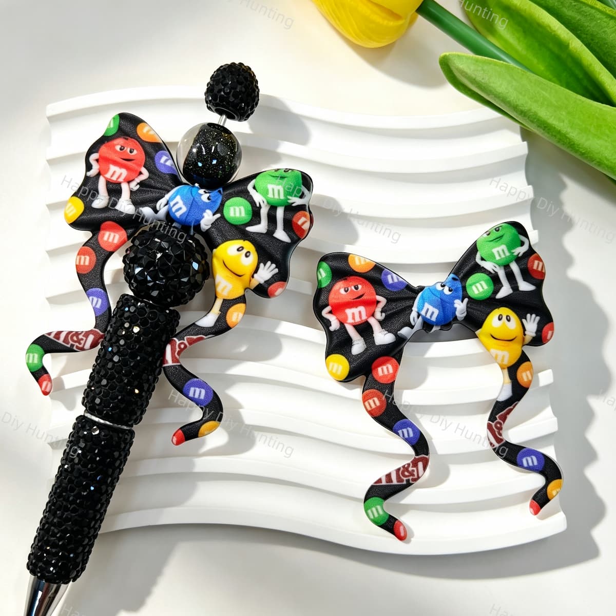 Bow-shaped silicone focal beads featuring a colorful cartoon candy character design. Soft, durable, and flexible, perfect for beadable pens, keychains, and handmade crafts.