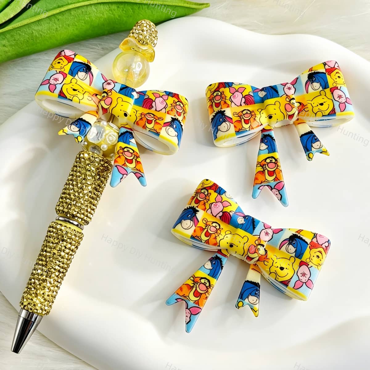 Bow-shaped silicone focal beads featuring a colorful cute bear and friends cartoon design. Soft, durable, and flexible, perfect for beadable pens, keychains, and handmade crafts.