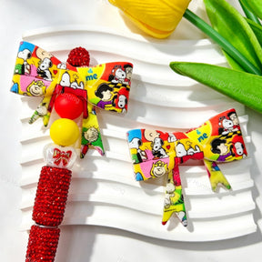 Bow-shaped silicone focal beads featuring a colorful striped cartoon character print design. Soft, durable, and flexible, perfect for beadable pens, keychains, and handmade crafts.