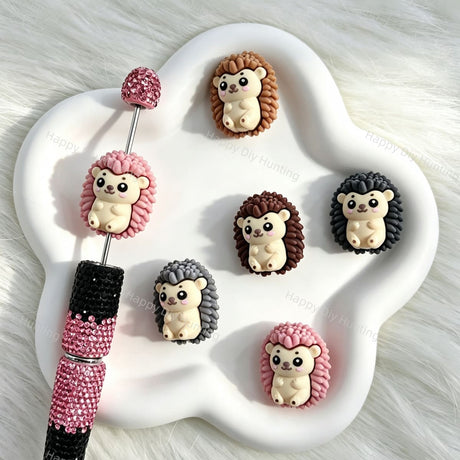 Silicone focal beads featuring a cute 3D hedgehog cartoon design. Soft, durable, and flexible, perfect for beadable pens, keychains, and handmade crafts.