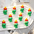 Cute green stitched rag doll 3D cartoon pen toppers with red bow and spiky hair, handmade bead pen decorative figure caps for wholesale craft supplies