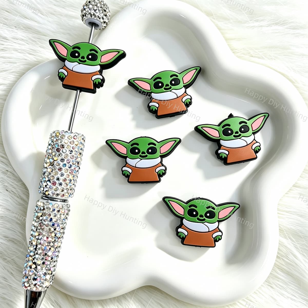 Silicone focal beads featuring a cute big green eared alien cartoon design. Soft, durable, and flexible, perfect for beadable pens, keychains, and handmade crafts.