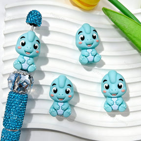 Silicone focal beads featuring a cute light blue 3D dinosaur design. Soft, durable, and flexible, perfect for beadable pens, keychains, and handmade crafts.
