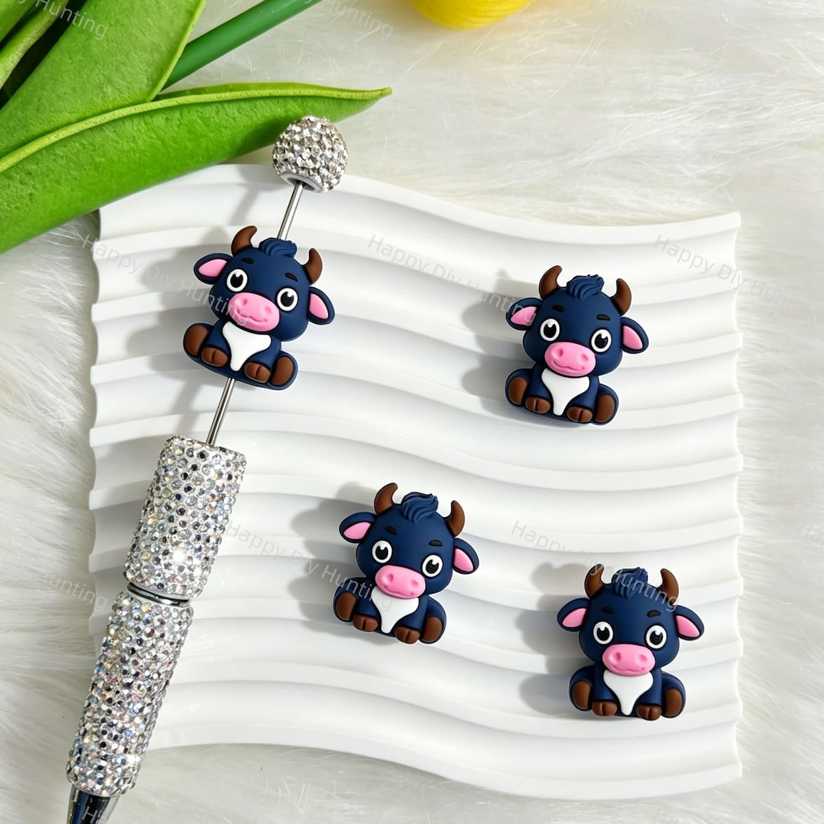 Silicone focal beads featuring a cute navy blue sitting cartoon cow 3D design. Soft, durable, and flexible, perfect for beadable pens, keychains, and handmade crafts.
