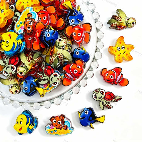 Acrylic focal beads featuring cute ocean cartoon fish, turtle, and starfish designs. Lightweight, colorful, and durable, perfect for beadable pens, keychains, and handmade crafts.
