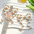 Bow-shaped silicone focal beads featuring a cute superhero girls cartoon print design. Soft, durable, and flexible, perfect for beadable pens, keychains, and handmade crafts.