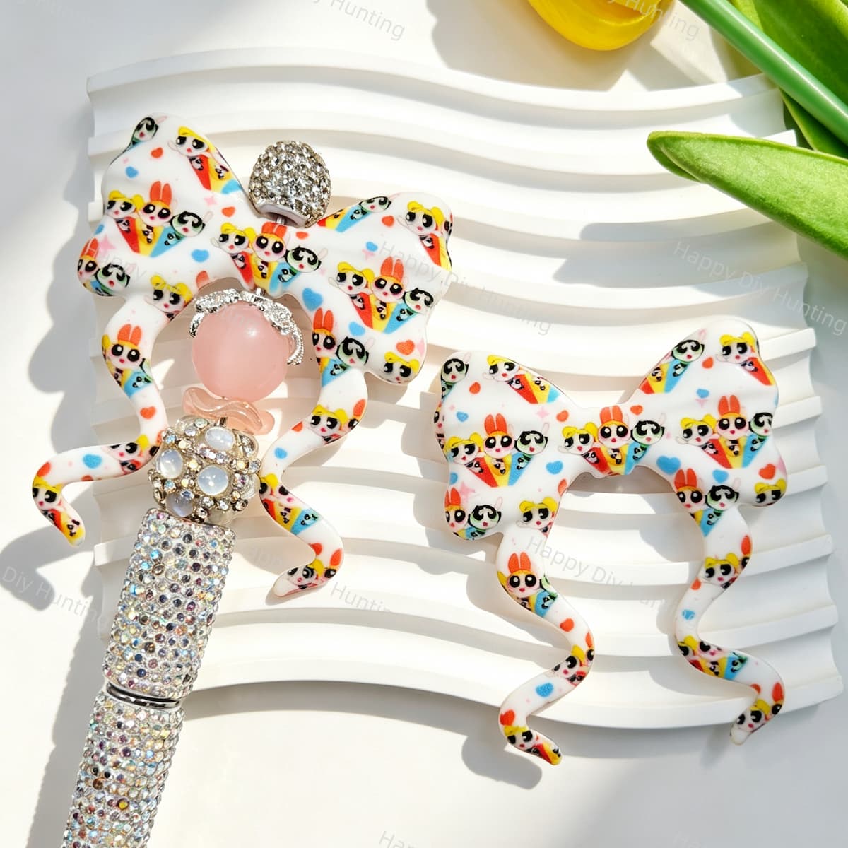 Bow-shaped silicone focal beads featuring a cute superhero girls cartoon print design. Soft, durable, and flexible, perfect for beadable pens, keychains, and handmade crafts.