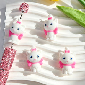Silicone focal beads featuring a cute white 3D cat design with a pink bow. Soft, durable, and flexible, perfect for beadable pens, keychains, and handmade crafts.
