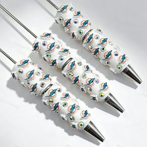 Dolphin sports team logo print sports beadable pens. Refillable and customizable, matching all focal beads and pen toppers. Perfect for game day gifts, DIY crafts, and handmade sports merchandise.