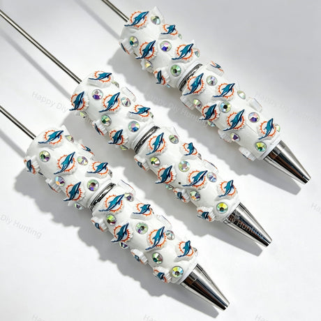 Dolphin sports team logo print sports beadable pens. Refillable and customizable, matching all focal beads and pen toppers. Perfect for game day gifts, DIY crafts, and handmade sports merchandise.
