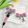 Bow-shaped silicone focal beads featuring a pink checkerboard pattern with a glossy drip finish. Soft, durable, and flexible, perfect for beadable pens, keychains, and handmade crafts.
