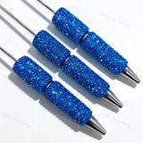 Three electric blue rhinestone beadable pens displayed on a white surface. Each pen features an electric blue rhinestone-encrusted barrel and a silver metal tip. Perfect for DIY beadable pen projects, custom crafts, and handmade gifts.